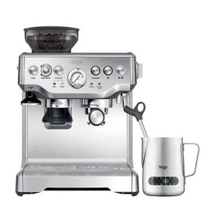 Espresso machine with milk jug on white background